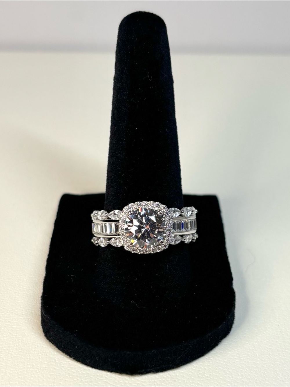 Sterling silver ring featuring a 3+ carat round white CZ stone with halo